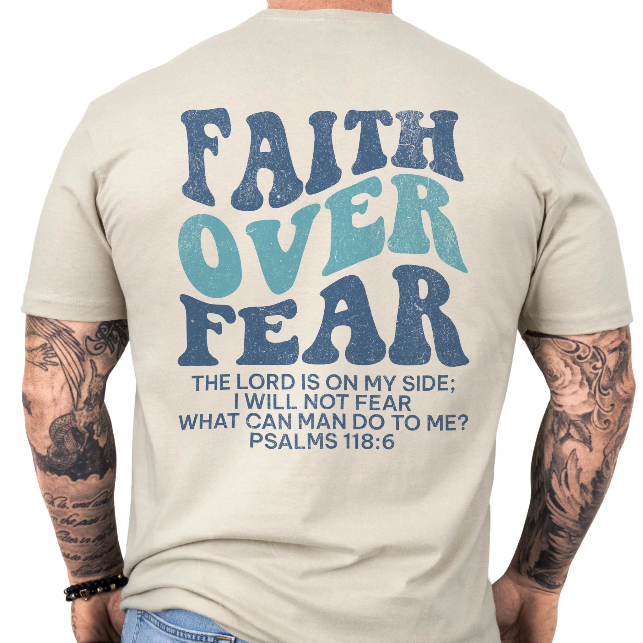 Sand Oakley June t shirt, mens fit, large back lettering reads Faith Over Fear with supporting scripture lines, studio back view