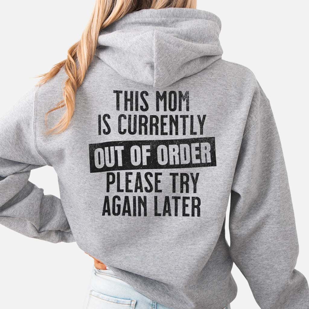 Sport Grey hoodie – large back text reads “This Mom Is Currently Out of Order, Please Try Again Later”, relaxed modern fit with hood up, studio back view
