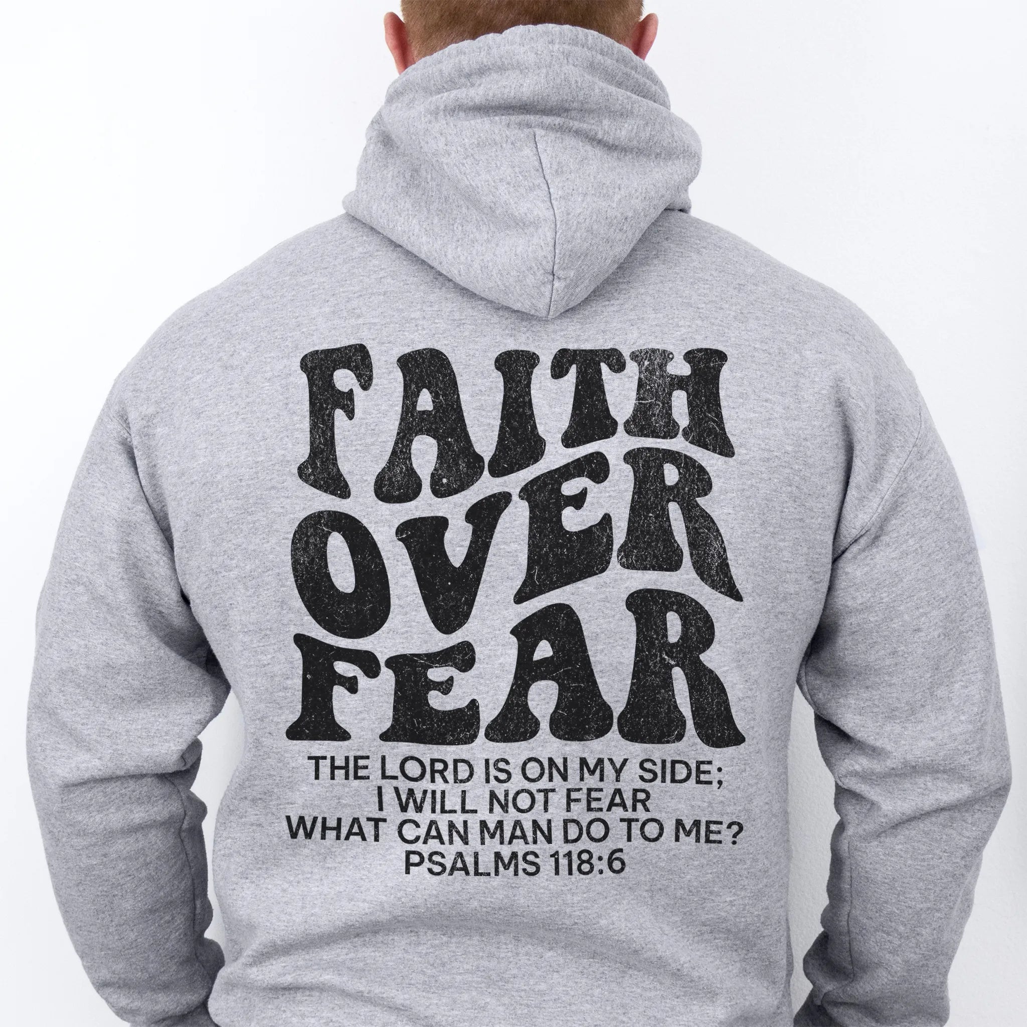 Sport Grey Oakley June hoodie, mens fit, large back lettering reads Faith Over Fear with supporting scripture lines, studio back view
