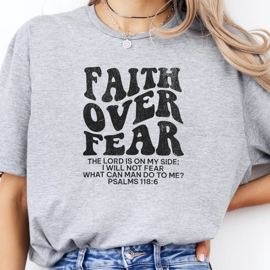 Sport Grey Oakley June t shirt, large front lettering reads Faith Over Fear with supporting lines The Lord Is On My Side I Will Not Fear What Can Man Do To Me, studio front view