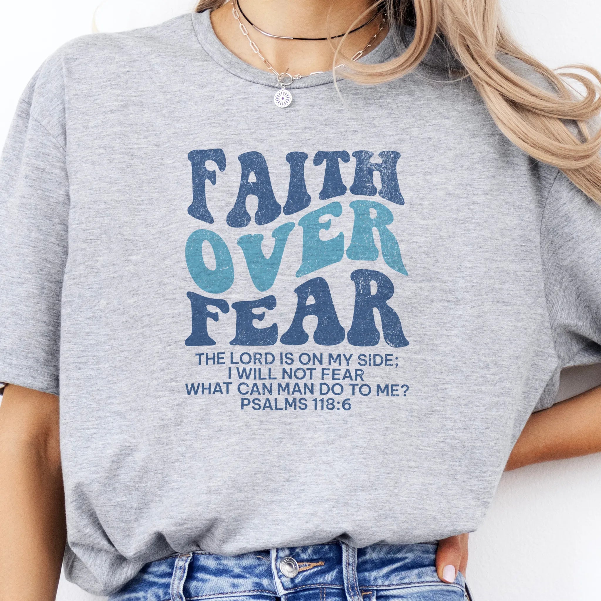 Sport Grey Oakley June t shirt, large front lettering reads Faith Over Fear with supporting lines The Lord Is On My Side I Will Not Fear What Can Man Do To Me, studio front view