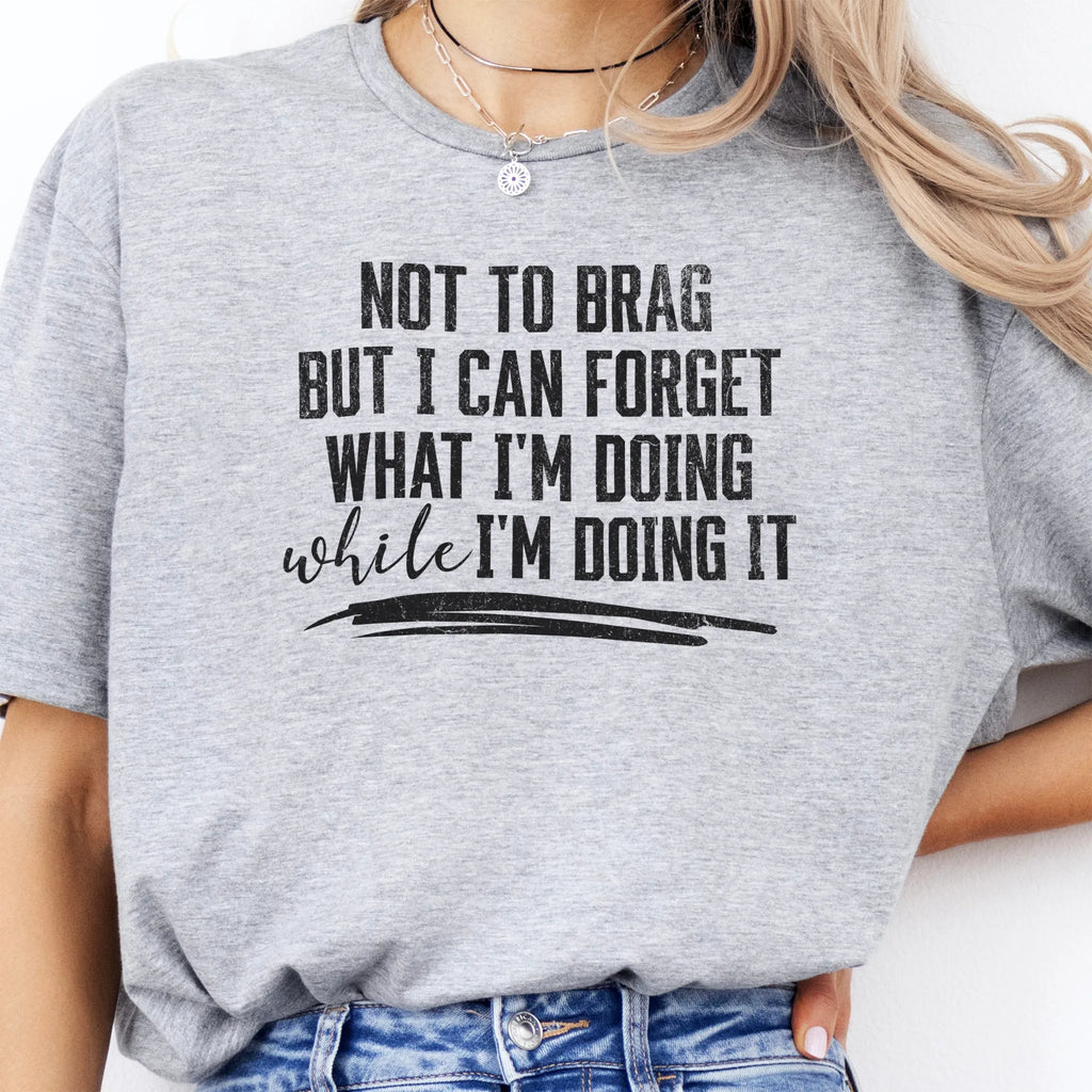 Sport Grey Oakley June T Shirt front view large text Not To Brag But I Can Forget What I’m Doing While I’m Doing It underline distressed print