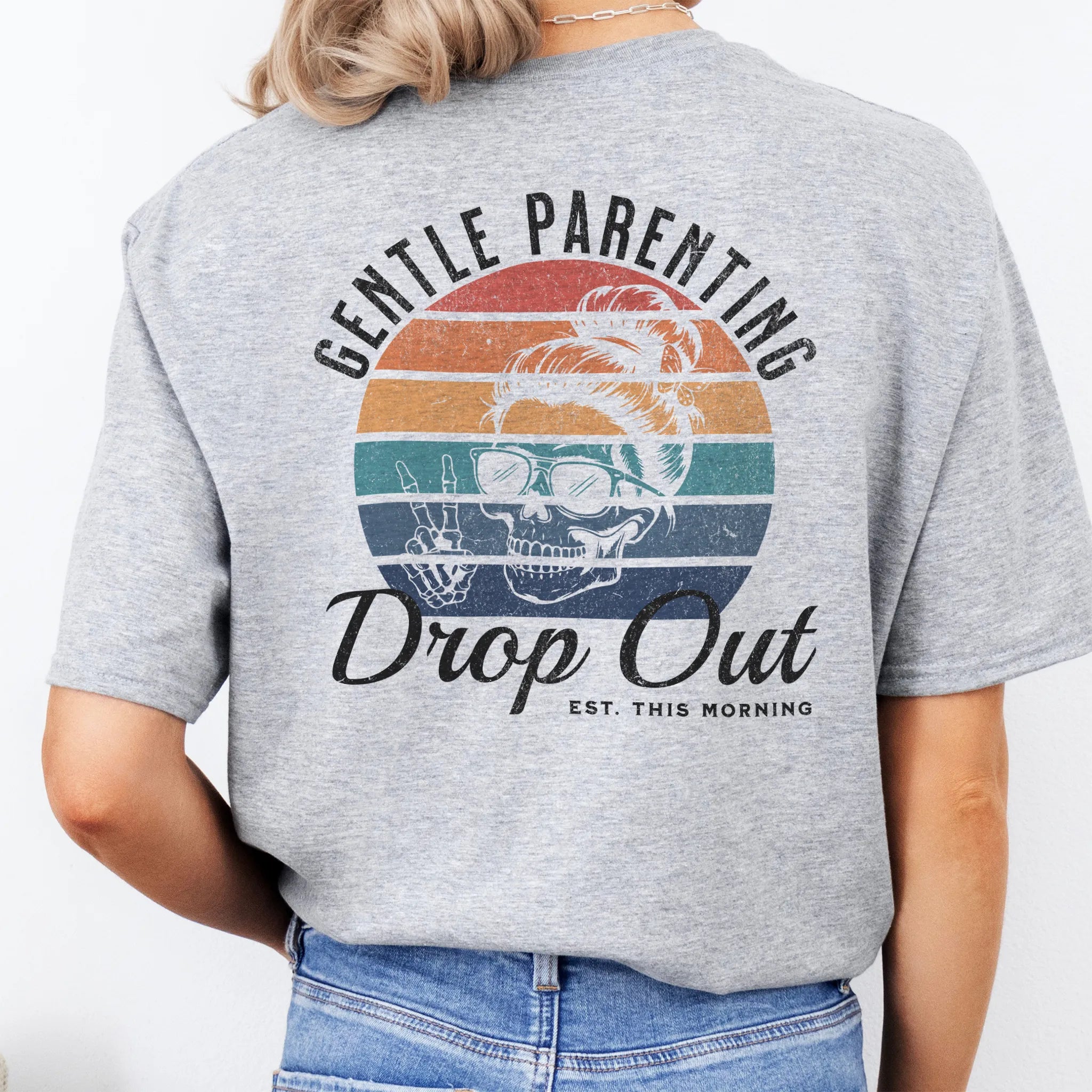 Sport Grey Oakley June T Shirt back view Gentle Parenting Drop Out large round retro badge skull with messy bun wearing sunglasses peace sign script Est This Morning distressed print