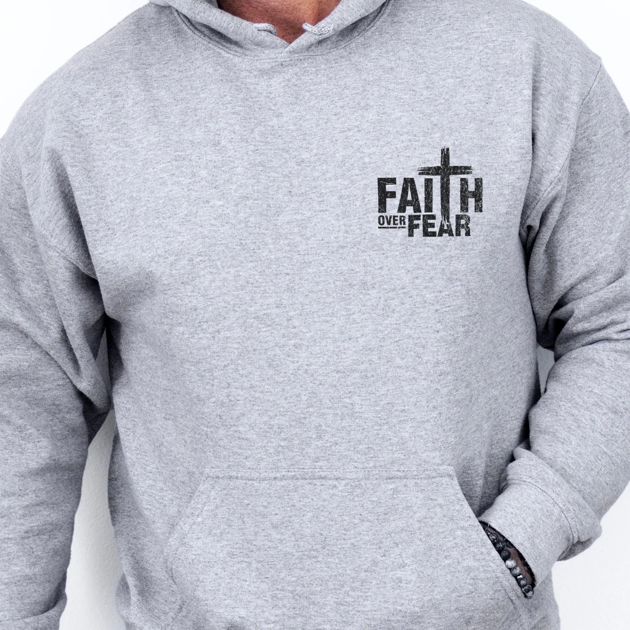 Sport Grey Oakley June hoodie, mens fit, left chest badge reads Faith Over Fear with cross, kangaroo pocket, studio front view