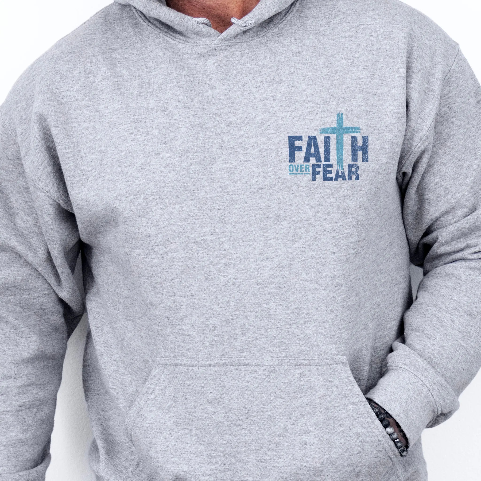 Sport Grey Oakley June hoodie, mens fit, left chest badge reads Faith Over Fear with cross, kangaroo pocket and relaxed modern fit, studio front view