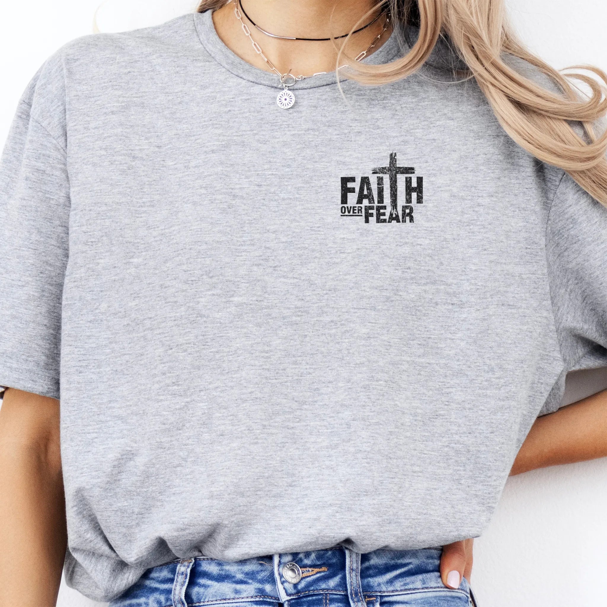 Sport Grey Oakley June t shirt, left chest badge reads Faith Over Fear with small cross, relaxed modern fit, studio front view