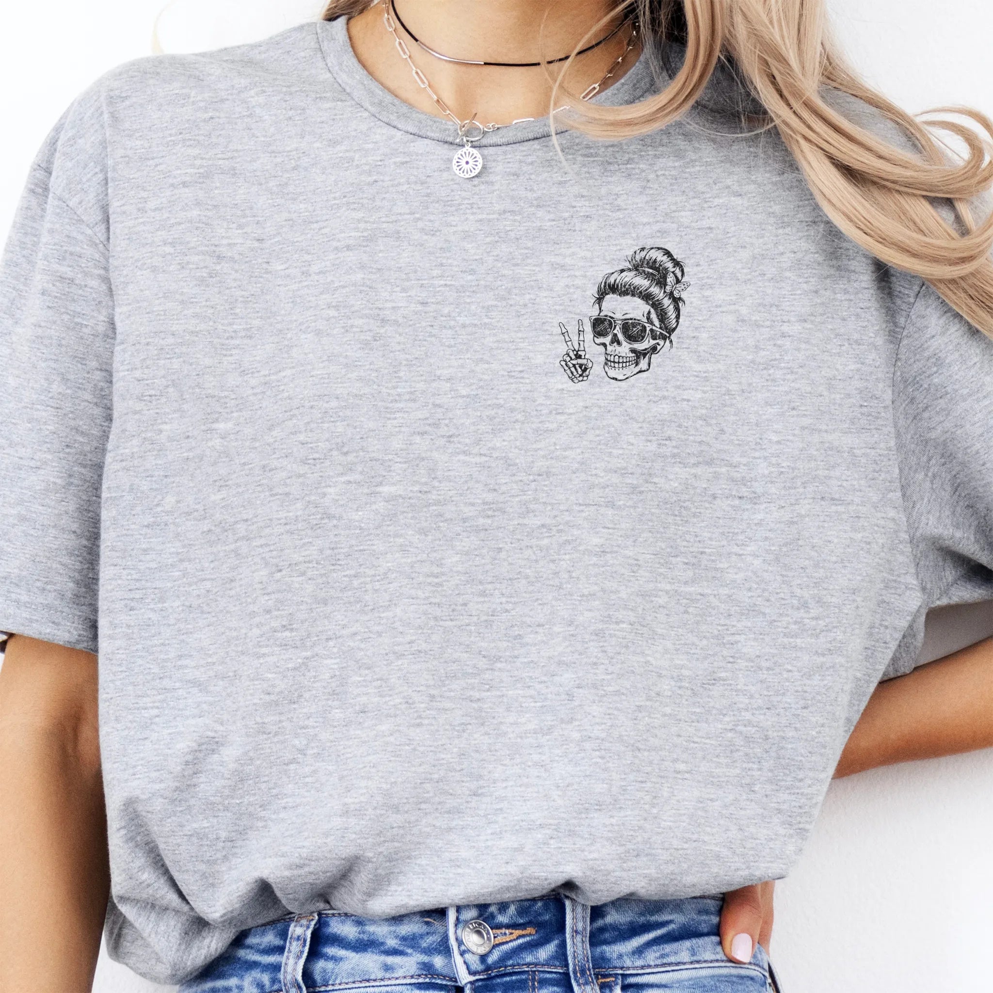 Sport Grey Oakley June T Shirt front view small left chest skull with messy bun sunglasses peace sign minimalist mark distressed print