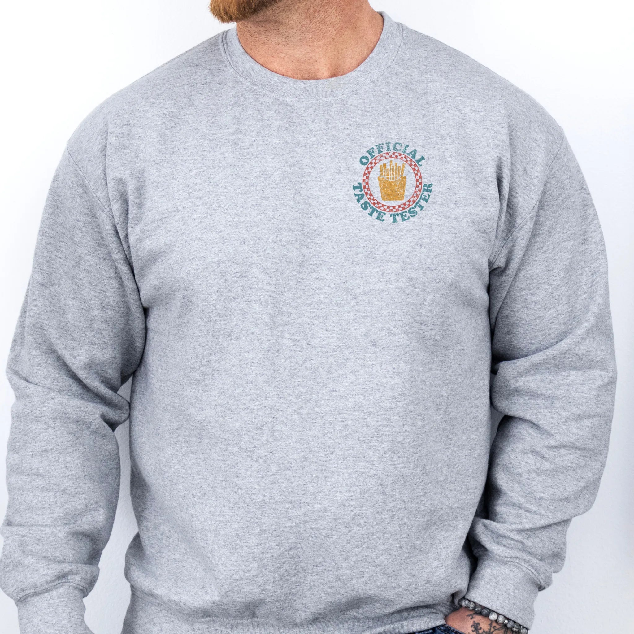 Sport Grey Oakley June Sweatshirt front view Dad Tax Official Taste Tester left chest badge retro circle fries emblem on a sweatshirt