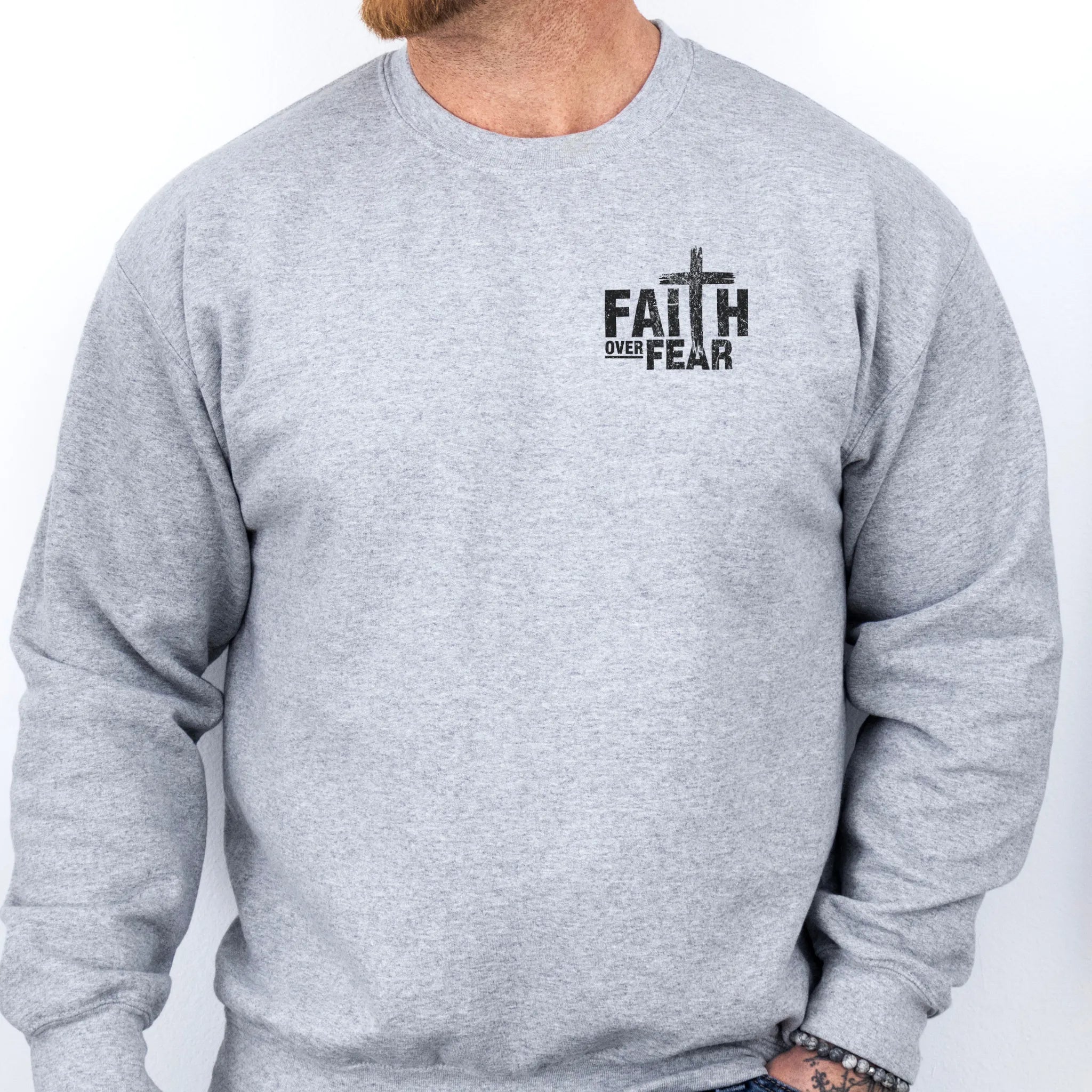 Sport Grey Oakley June sweatshirt, mens fit, left chest badge reads Faith Over Fear with cross, studio front view